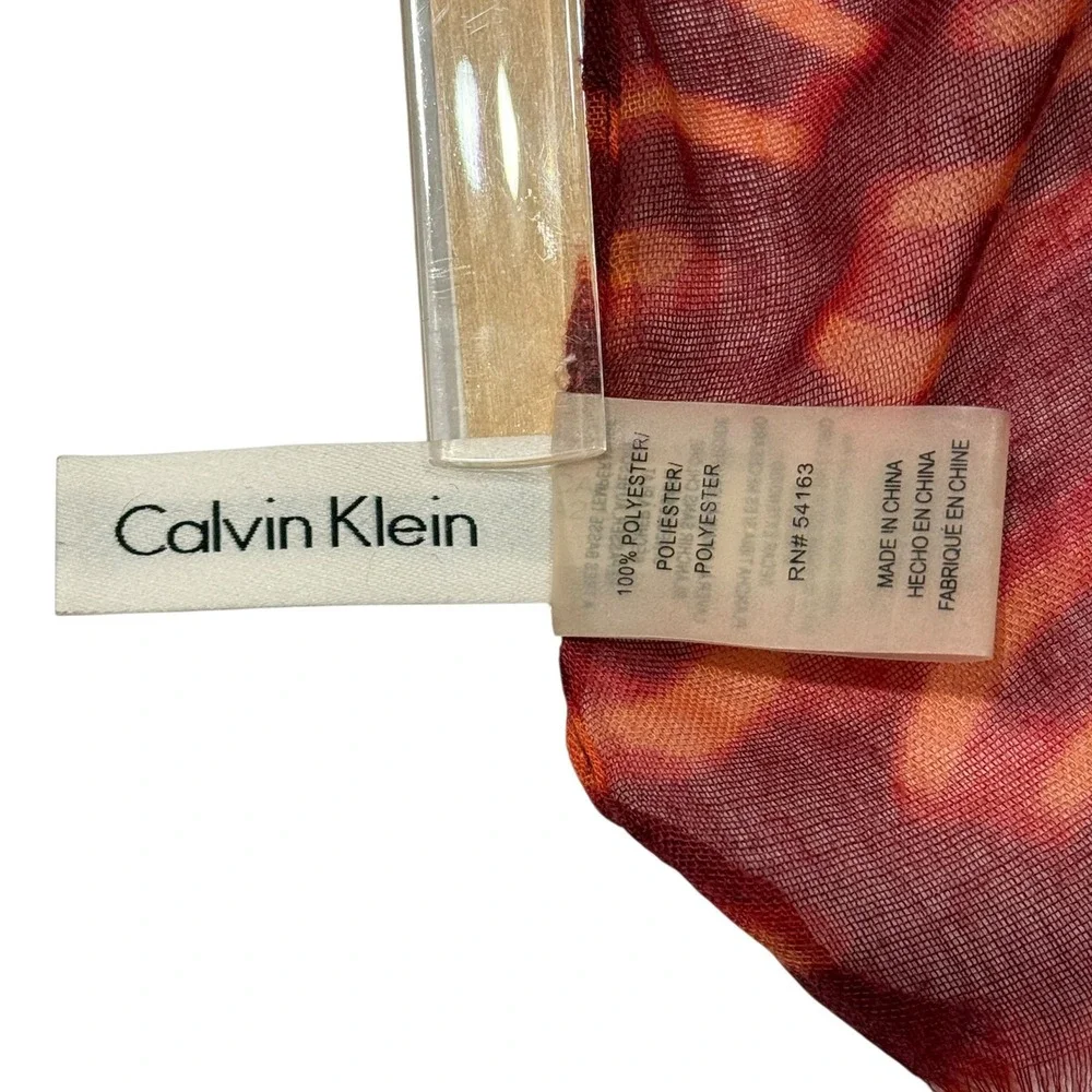 Calvin Klein Lightweight Scarf Red Orange Pattern Fringe Hem Gold Logo Charm